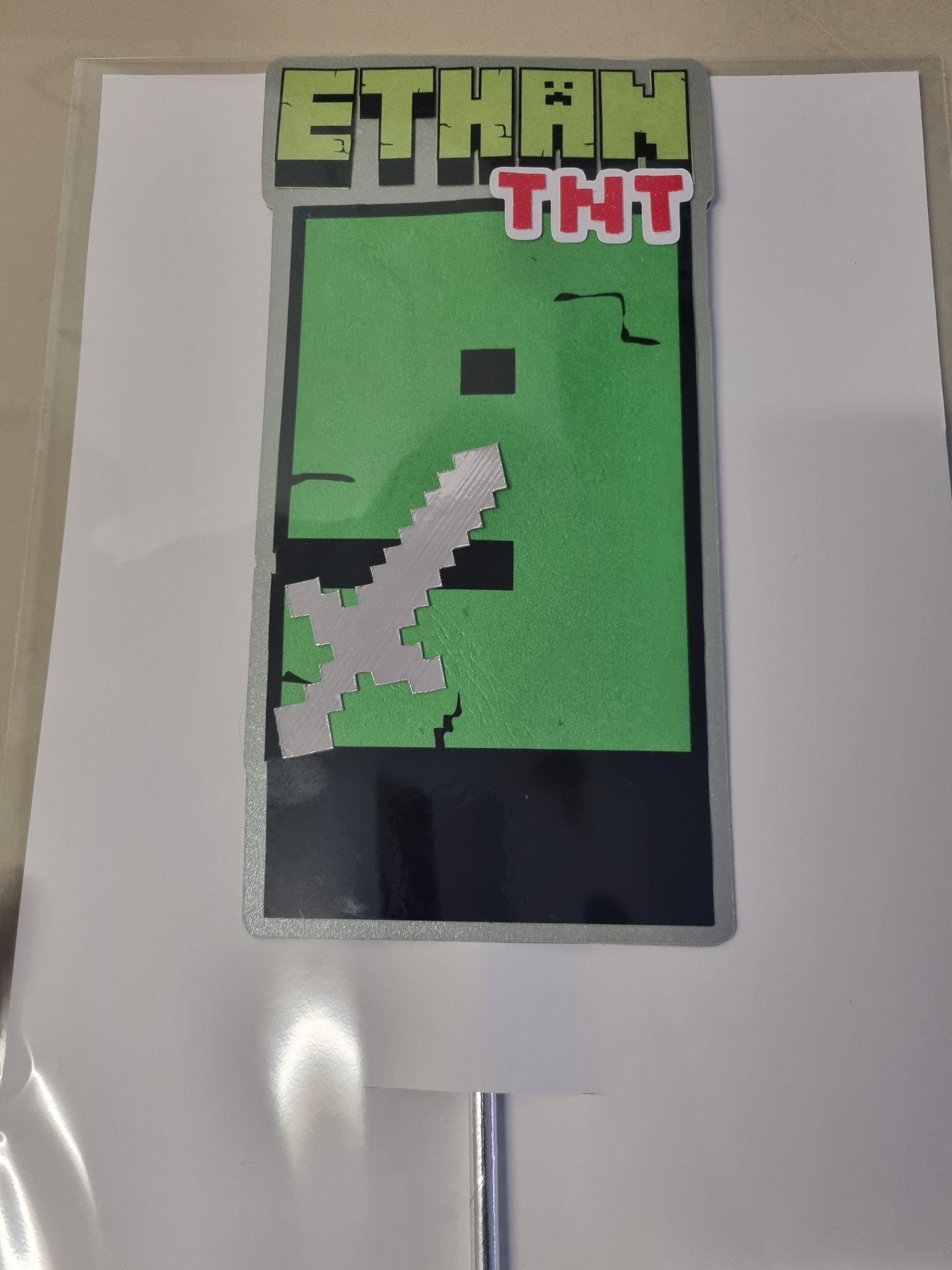 Pixelated character with a sword on a green screen, likely for a video game or digital content.