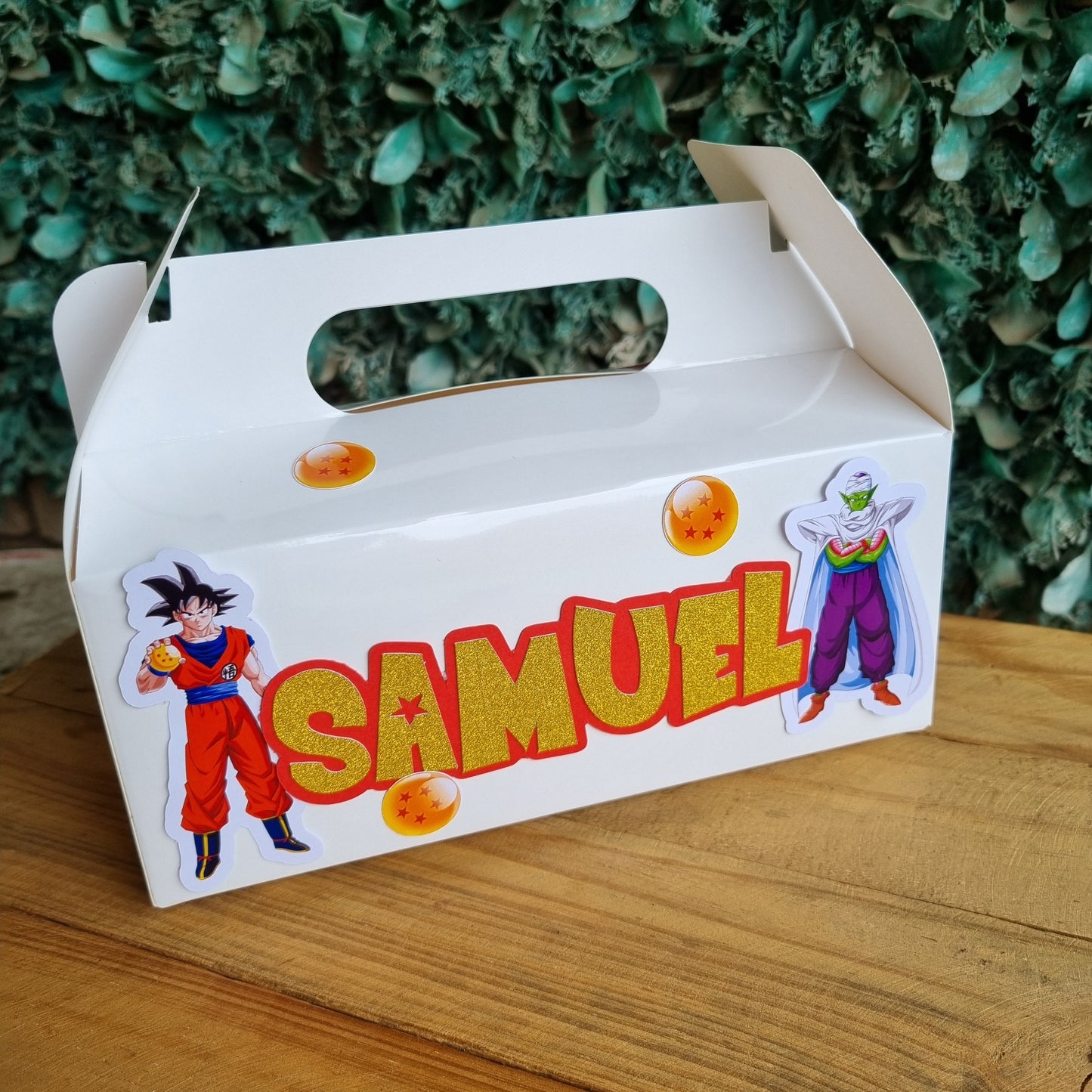 Carton with 'Samuel' branding on a wooden surface and green grass background