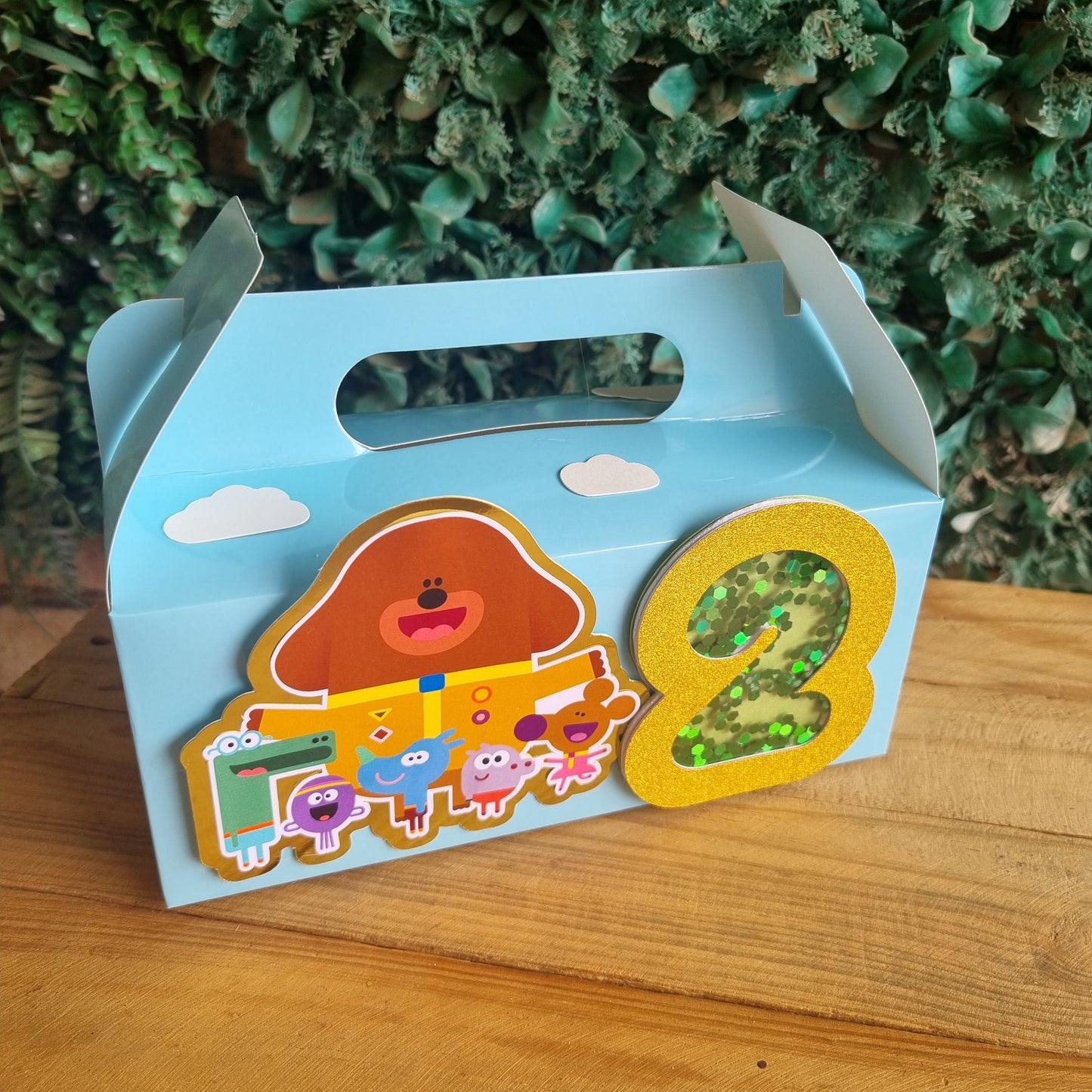 Children's book with colorful illustrations on a wooden surface