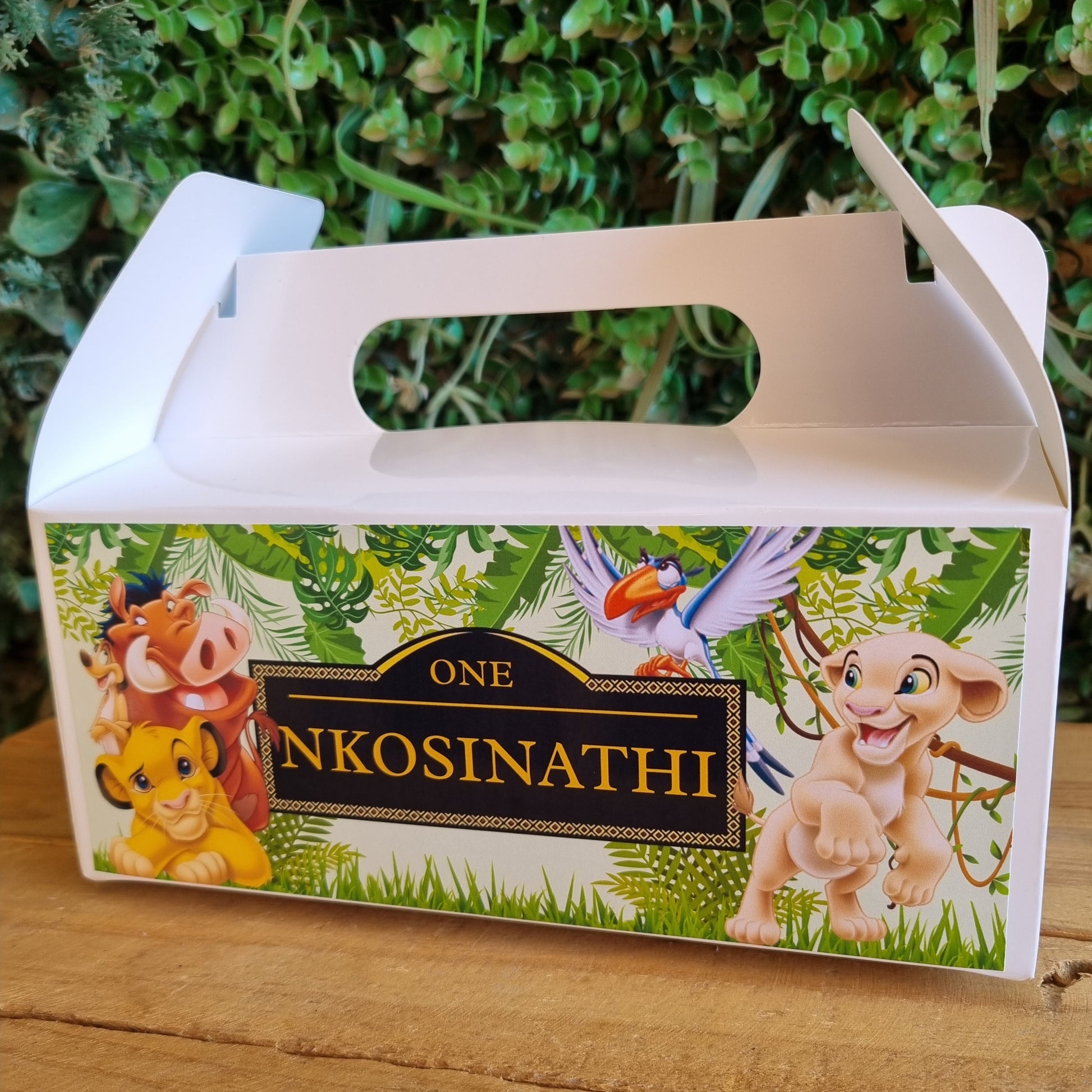 Product packaging with cartoon characters on a wooden surface