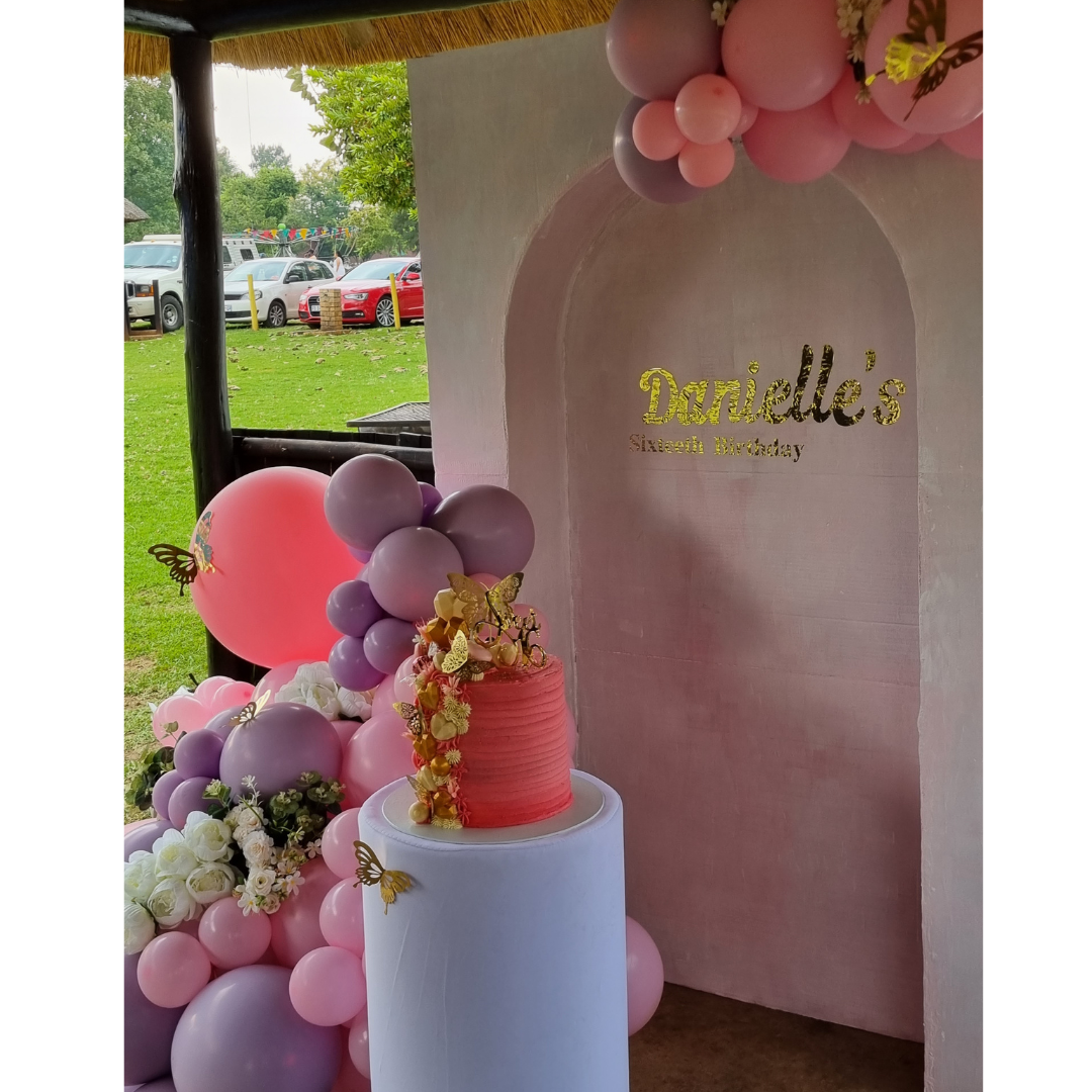 BUTTERFLY AND FLOWER Inverted Chiara Backdrop with Organic Balloon Garland and Plinth