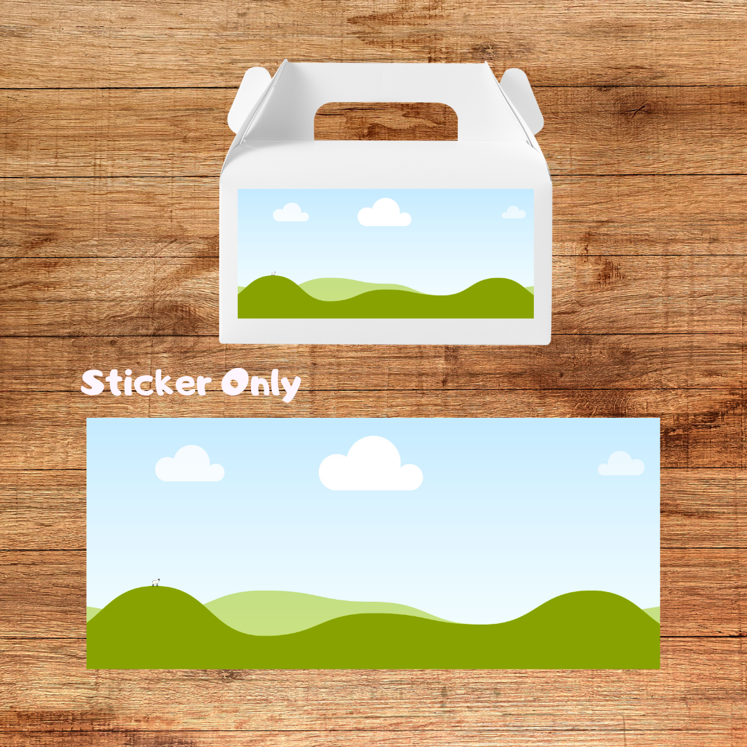 Sticker of a landscape with green hills and blue sky on a wooden surface
