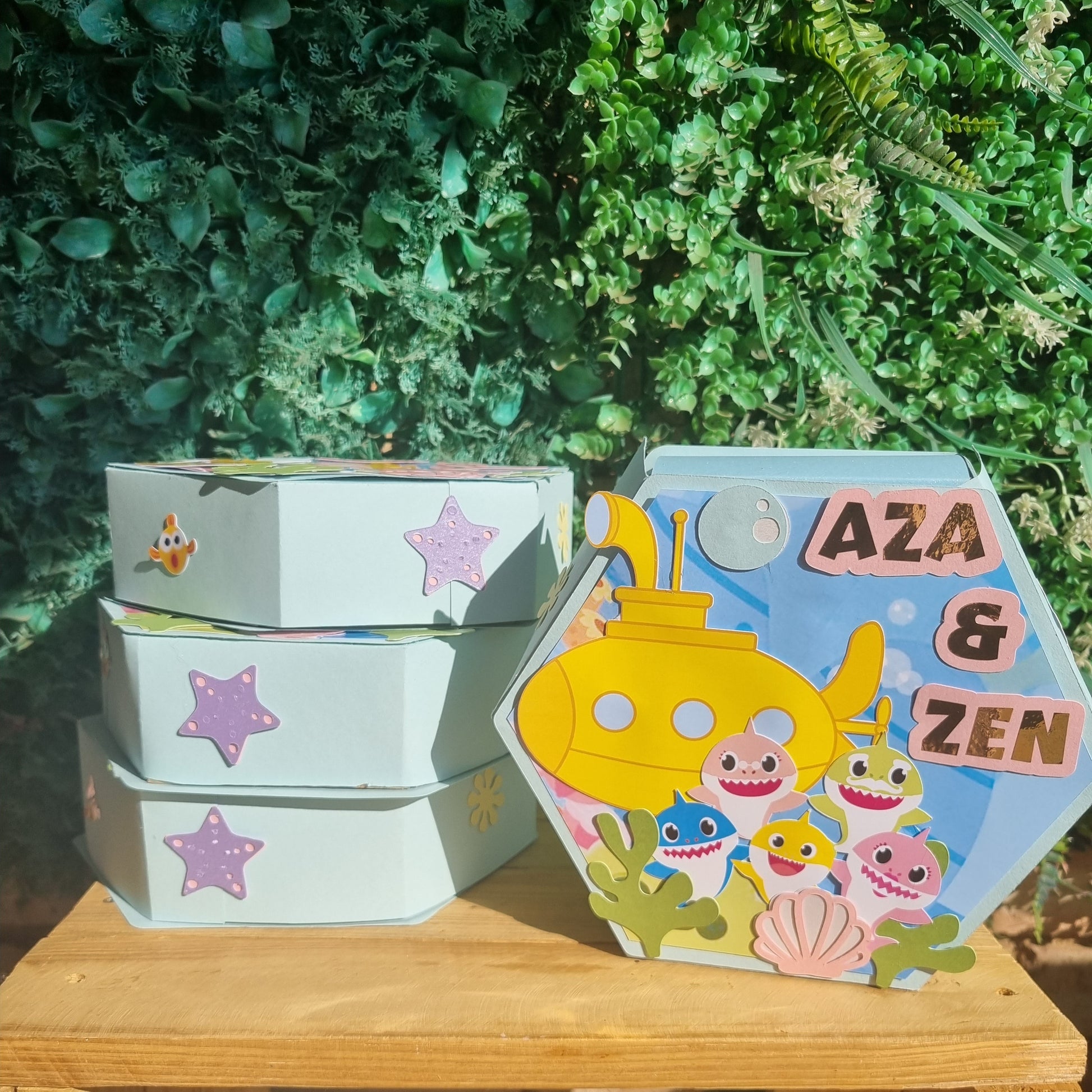 Colorful children's book with cartoon characters on a wooden surface and greenery in the background