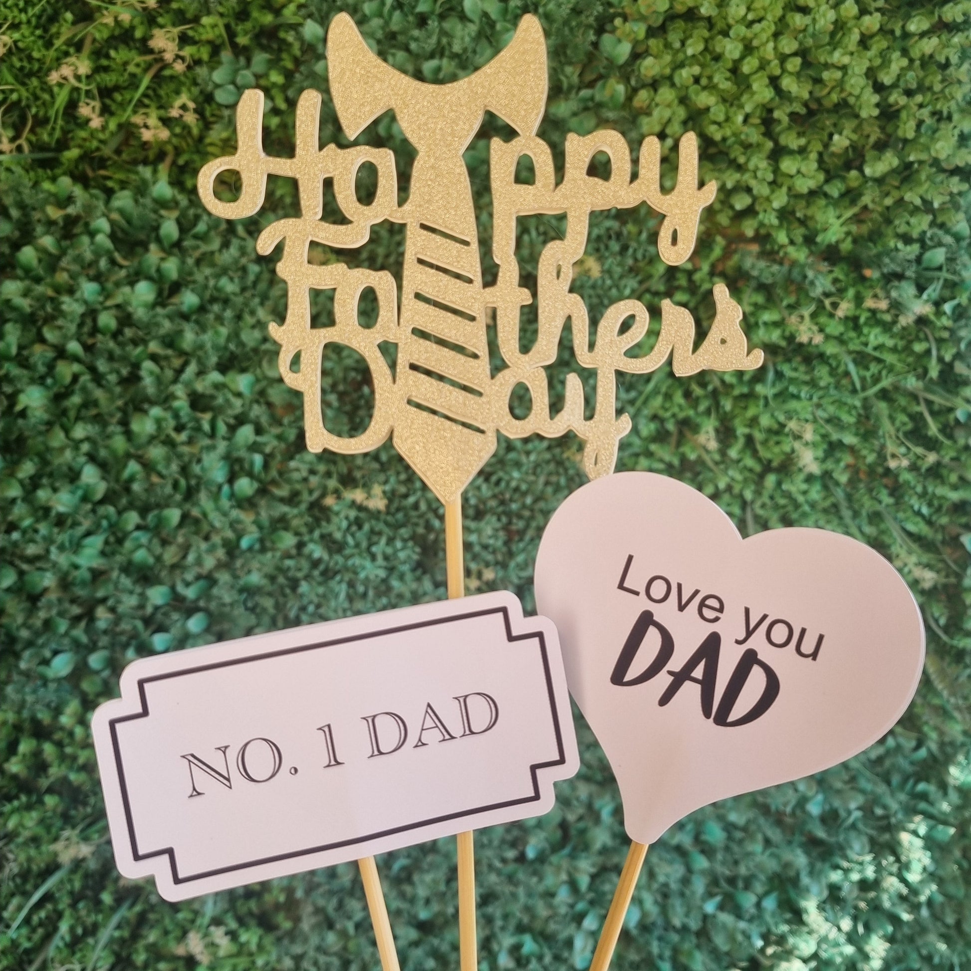 Decorative picks with 'Happy Father's Day' and 'Love you DAD' text on a green textured background.