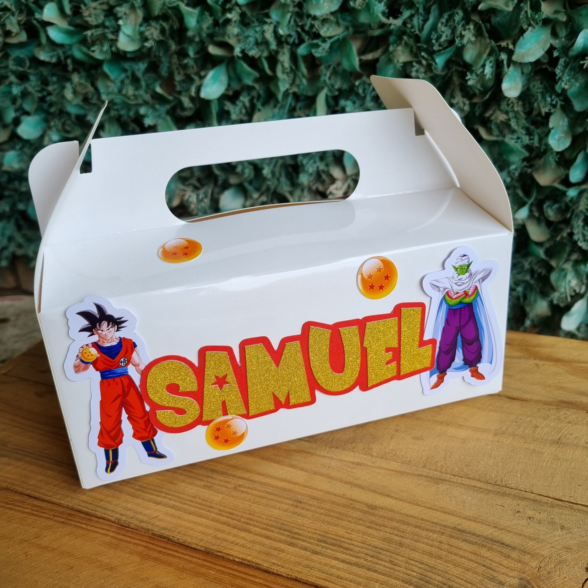 Carton with 'Samuel' branding on a wooden surface and green grass background