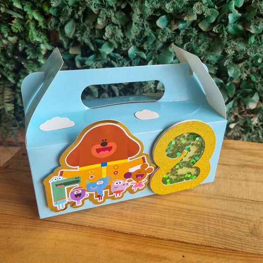 Children's book with colorful illustrations on a wooden surface