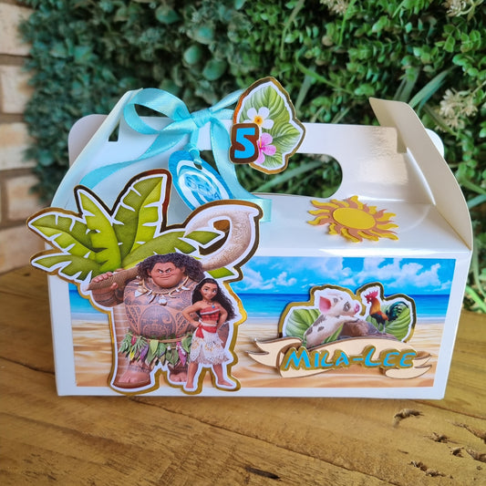 Decorative birdhouse with tropical-themed stickers on a wooden surface