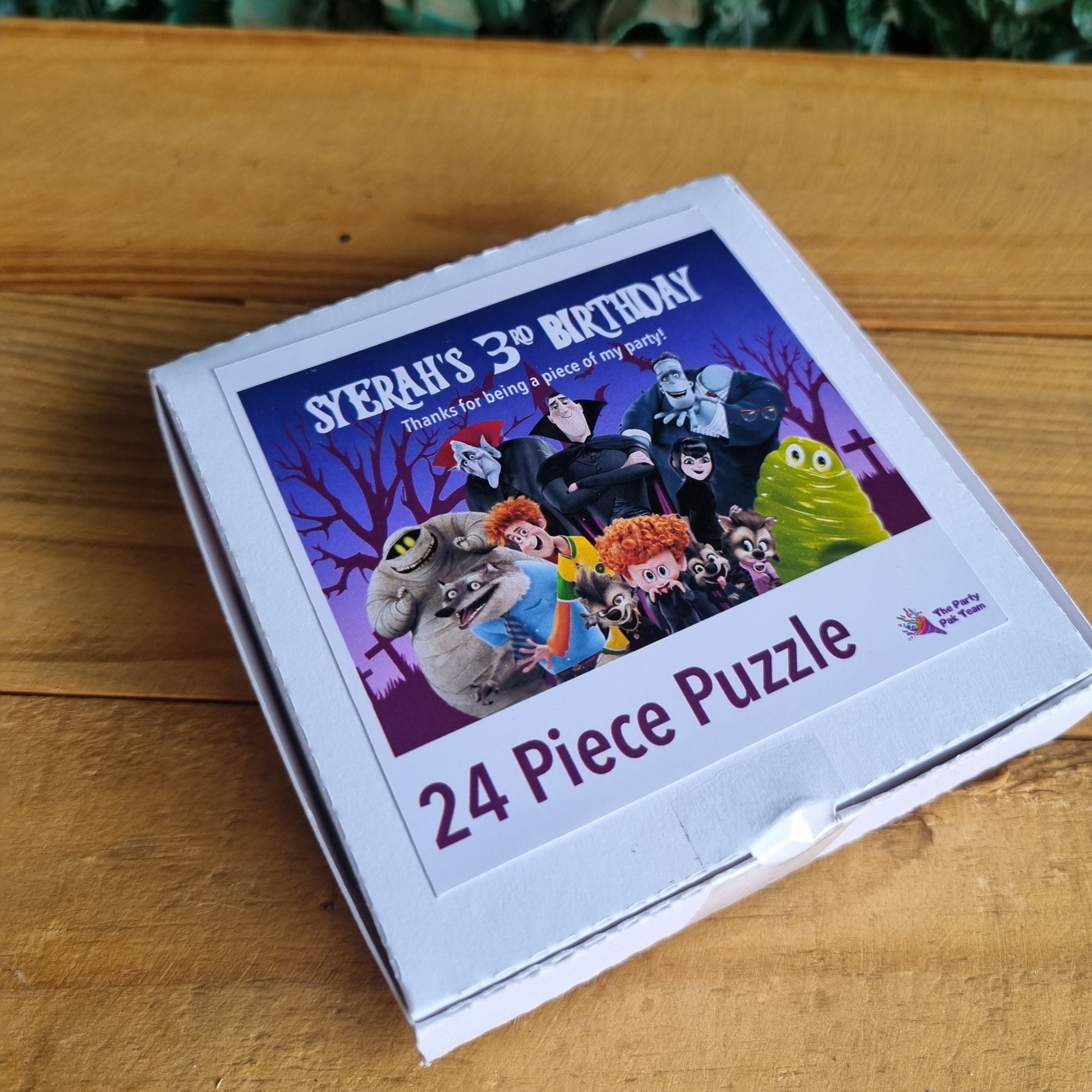 24 piece puzzle box with colorful graphics on a wooden surface
