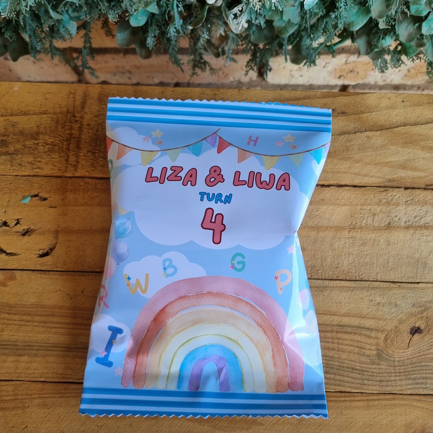 Colorful snack package with 'Liza & Liva' branding on a wooden surface