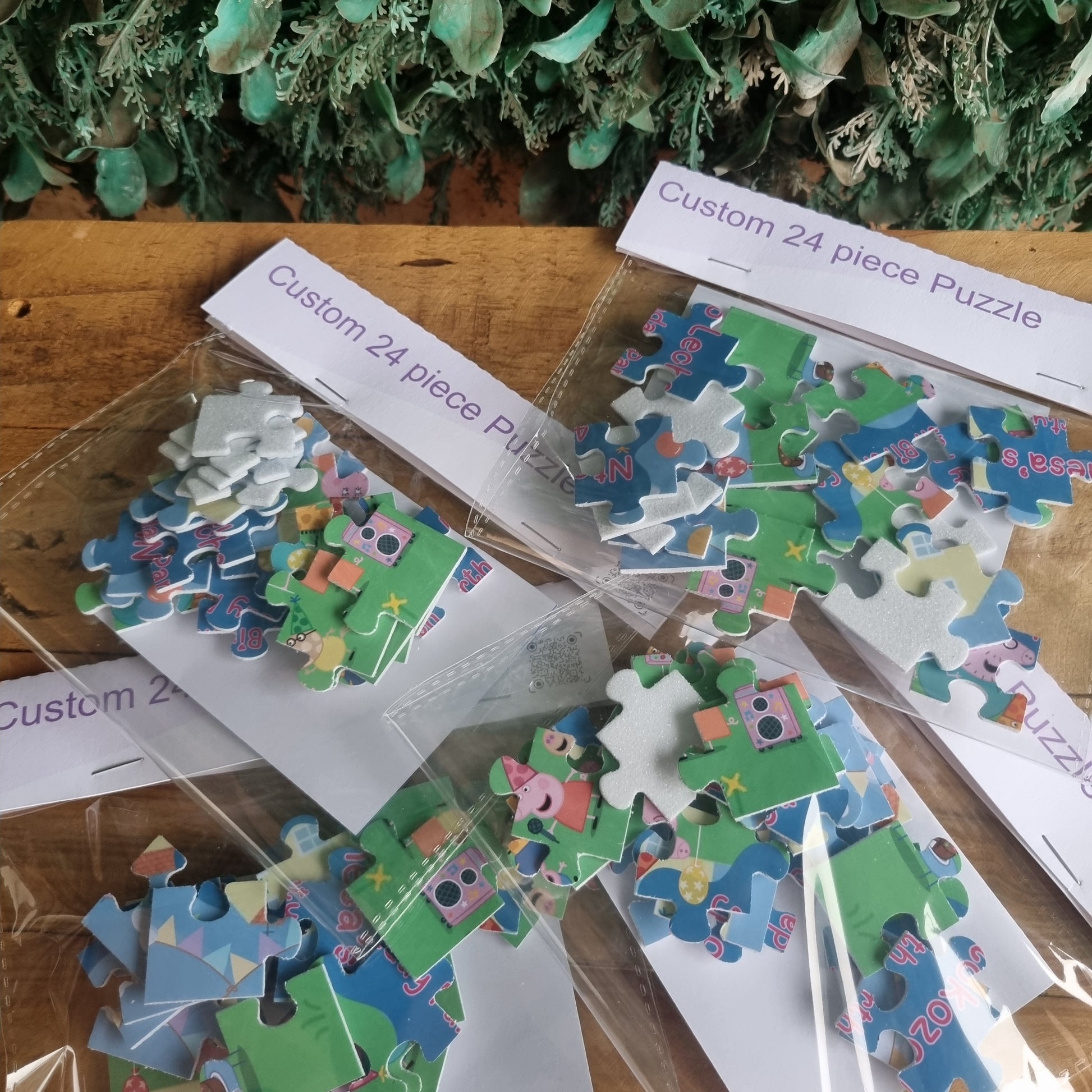 Jigsaw puzzle pieces on a wooden surface with packaging labels.