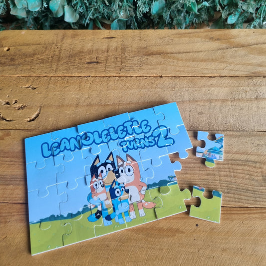 Puzzle with cartoon characters on a wooden surface next to green foliage
