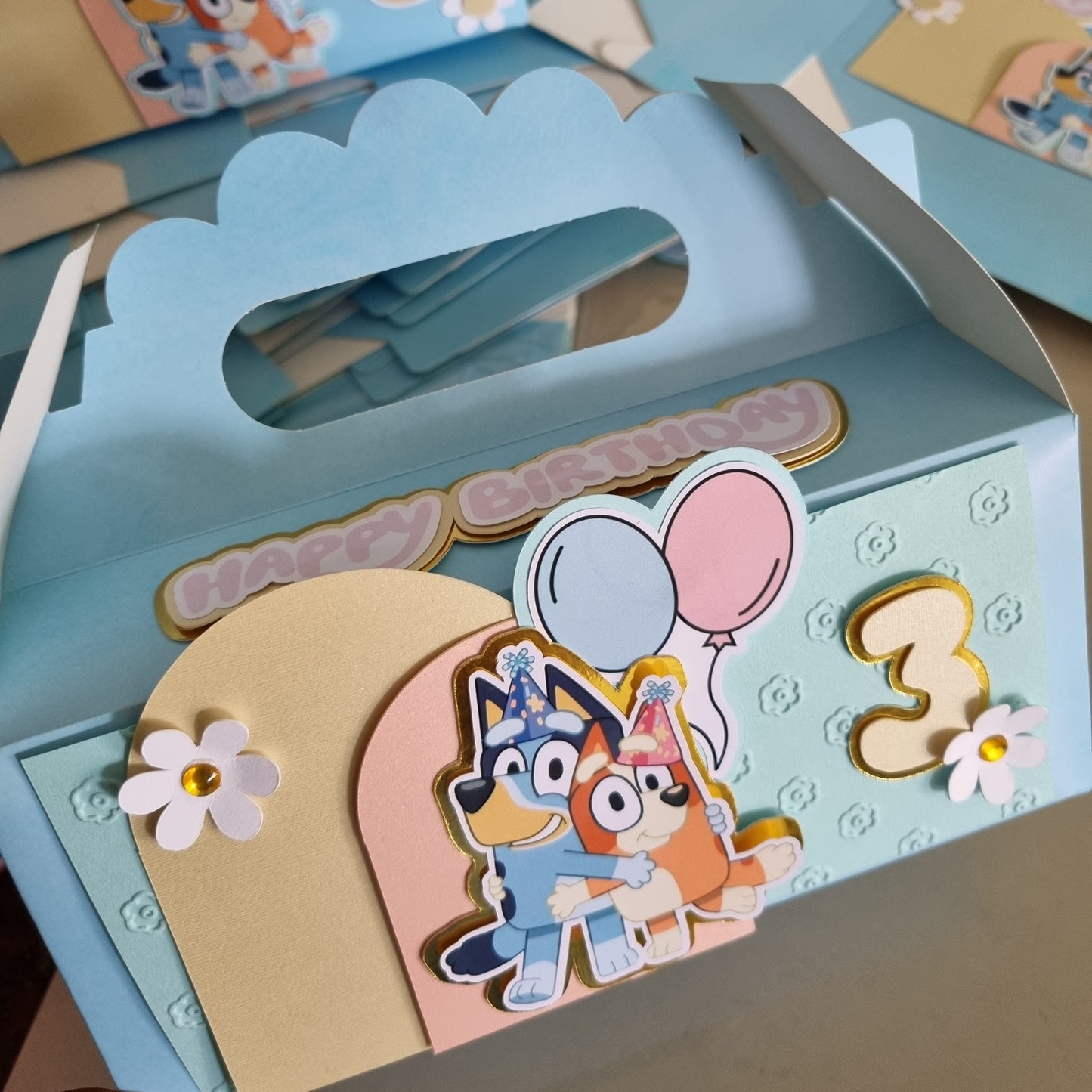 Children's book with colorful illustrations and a cartoon character on a light blue background