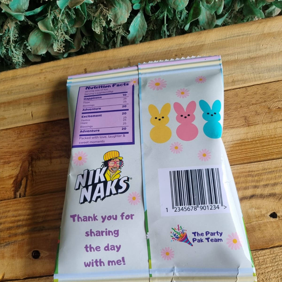 Nik Naks snack package with cartoon characters on a wooden surface
